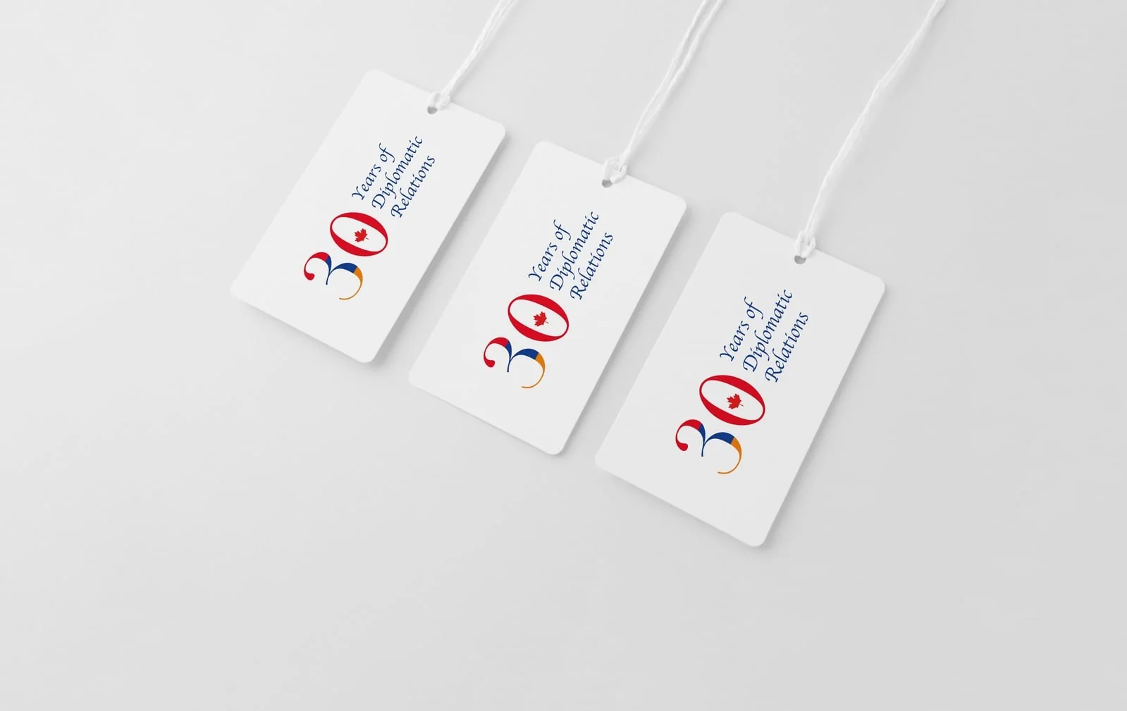 Thirtieth anniversary hang tags on white cord